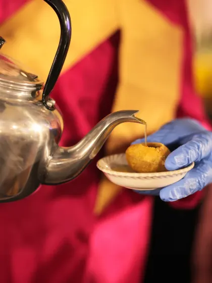 The quintessential Indian street food experience, delivered with impeccable hygiene and style. Our staff serves pani puri, filling the crispy spheres with tangy and spicy water from a traditional kettle.