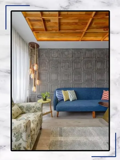 This living room is a perfect example of eclectic charm. The mix of a floral sofa, a modern blue couch, and a wooden ceiling creates a unique and inviting space to relax.
