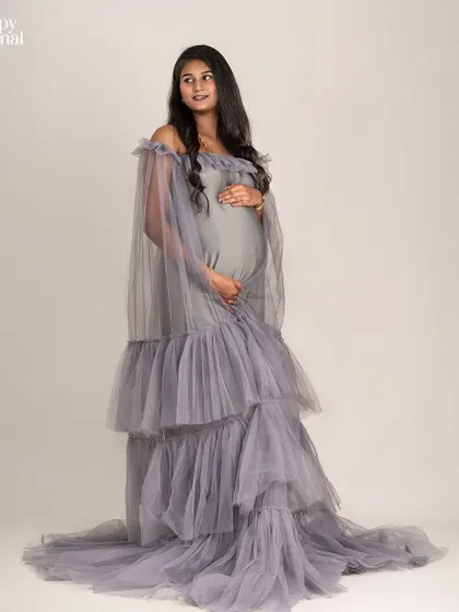 The layers of tulle on this grey gown create beautiful texture and movement. This standing pose shows off the full silhouette of the dress and the lovely baby bump.