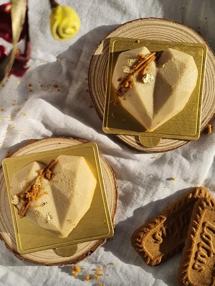 These heart-shaped mini cheesecakes are a favorite for anniversaries, Valentine's Day, or just as a sweet gift. They are topped with a sprinkle of gold leaf for an extra touch of elegance.