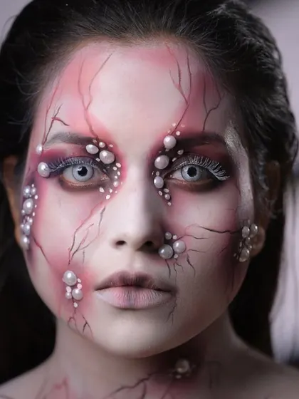 A direct, chilling stare from the finished character, showcasing the power of using contact lenses in SFX makeup.