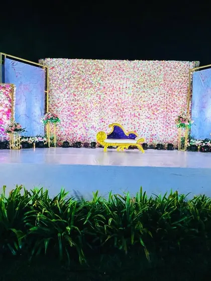 A wider shot of the floral wall stage, showing how the design fills the space and creates a truly immersive experience.