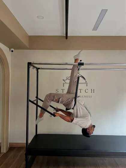 Strength meets control. This advanced Cadillac pose demonstrates the incredible core strength and flexibility we build. It's about mastering your body through precise, challenging movements.