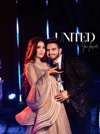 "United in Love." A celebratory portrait of the couple, holding drinks and smiling. This shot perfectly captures the fun, party atmosphere of their engagement night.
