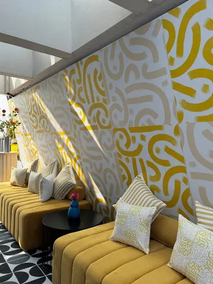 From concept to execution in just 42 hours. This St. Tropez inspired decor in Ahmedabad involved transforming a bungalow with custom-painted walls, fruit-based installations, and unique props, all on a tight deadline.