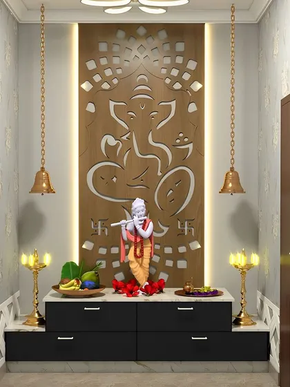 This pooja unit features a large, intricately carved Ganesha panel as a backdrop for a Krishna idol. The hanging bells and black marble base create a striking and divine space.