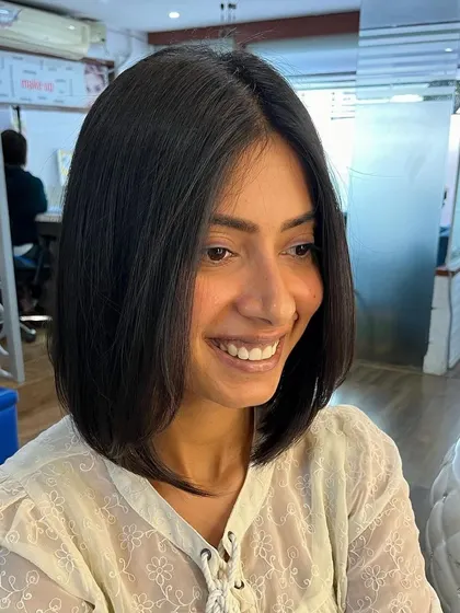 Another happy client with a perfectly executed angled bob.