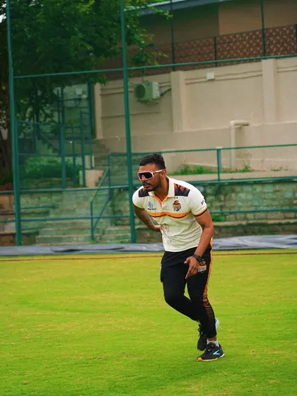 On the field, coaching athletes on movement mechanics. Proper running form and body control are fundamental skills that reduce injury risk and improve efficiency.