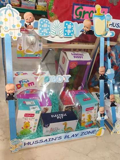 The 'Hussain's Play Zone' section, filled with musical and electric toys for the baby.