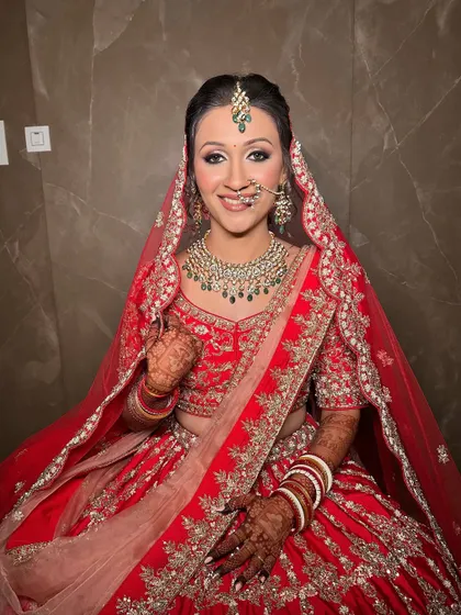 A happy bride, ready for her ceremony. The makeup is fresh and radiant, perfect for her special day.