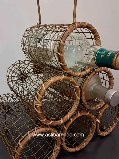 A detailed view of our 6-bottle cane wine basket, highlighting the horizontal storage design that keeps corks moist. It's a durable and rustic-chic solution for liquor storage.