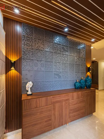 Another view of the artistic foyer unit, emphasizing the contrast between the dark grey panel and the warm wood of the console and ceiling rafters.