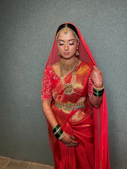 A serene, eyes-closed shot highlighting the shimmery eyeshadow and the flawless finish of the makeup.