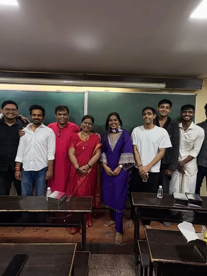 The team of male teachers and students posing together during the pooja celebrations, showcasing the camaraderie in our classes.