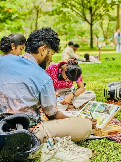 Here I am, guiding participants through their paintings. I make sure to give one-on-one attention to help you with your specific questions, whether it's about brush strokes or color mixing.