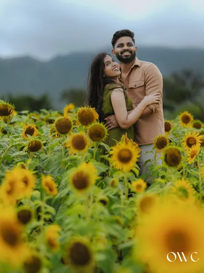 An embrace among the sunflowers. This pre-wedding portrait captures the warmth and love between the couple.