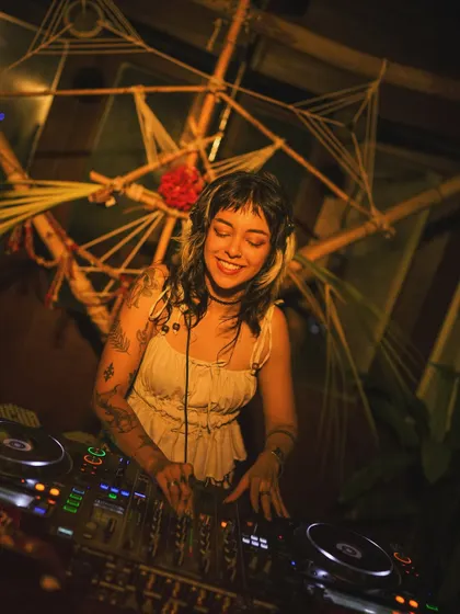 Finding my groove at a gig with some beautiful, earthy decor. The venue's vibe always adds a special layer to the music.