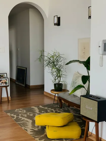 A quiet corner in Parineeti Chopra's home. The design is minimal but warm, with pops of color from the yellow floor cushions and the natural greenery. It's a space that feels calm, balanced, and full of her personality.