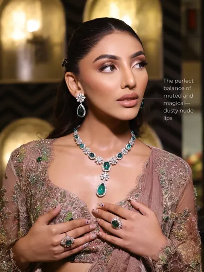 This image points out the perfect balance of muted, dusty nude lips that complement the dramatic eyes without overpowering them.