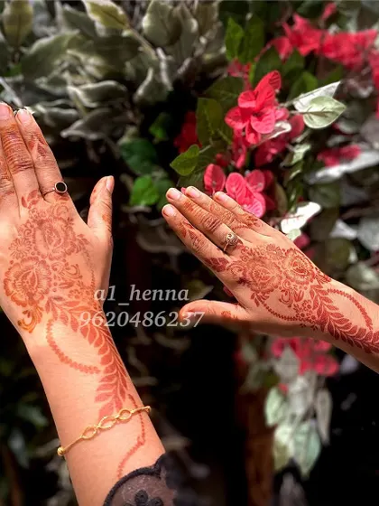 The beautiful, mature stain of my organic henna, pictured against a floral background. This shows the reddish-brown tones that develop after a day or two.