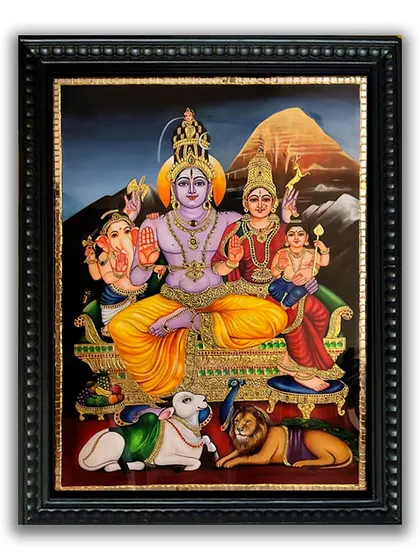 A framed version of our Shiva Family Tanjore painting, ready to be placed in a home. The classic black frame enhances the artwork's vibrant colors and golden details, making it a complete decorative piece.