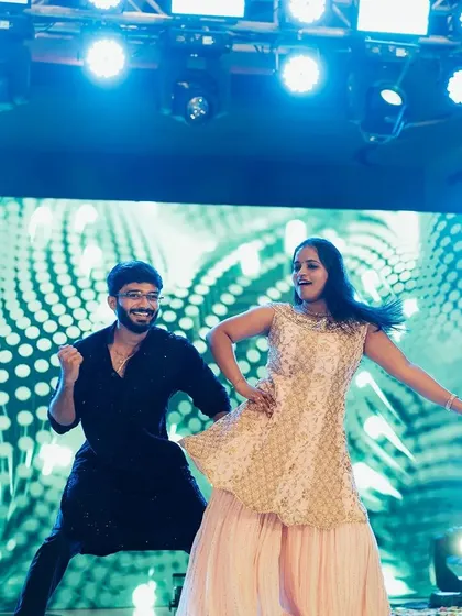 The couple shines under the spotlights during their sangeet performance. We work with you to select the perfect songs and create dance moves that make you feel like stars on your special night.