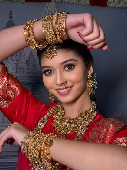 A joyful close-up of the bride. The drape is secure enough for her to move freely and express her happiness.