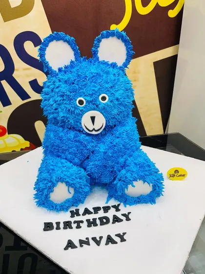 A unique 4kg 3D teddy bear cake made with textured blue fur-like piping.