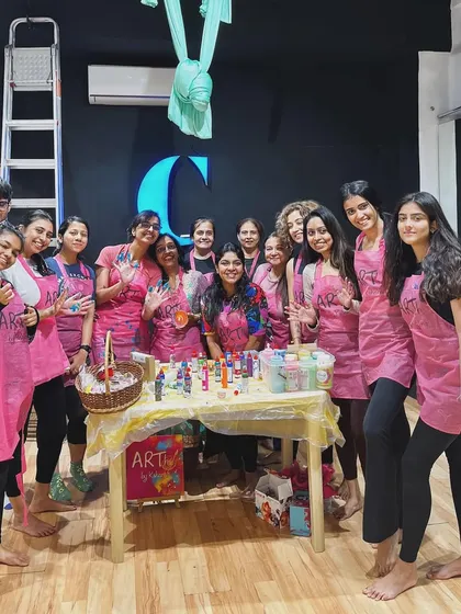 A group photo from my fluid art and aerial yoga collaboration workshop. It was a full house, with people from all walks of life coming together to try something new.