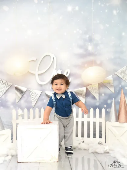 He's one and on the move! A candid moment from a winter-themed first birthday shoot, capturing his happy energy and excitement.