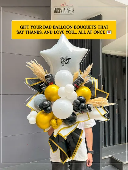 A large, handcrafted balloon bouquet for Father's Day, designed to look like a traditional flower bouquet but with a modern, masculine twist using black, gold, and white balloons.