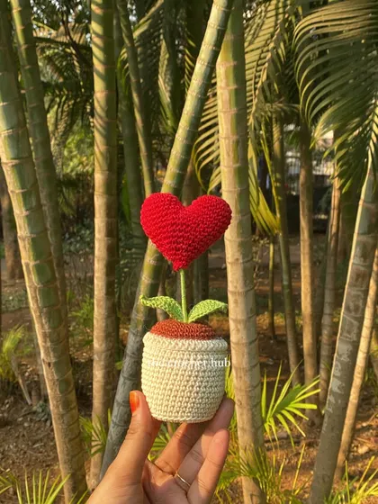 A simple red heart that says it all. I love taking my creations outdoors to capture them in the sunlight. This handmade heart pot is a perfect, lasting gift for someone you love, no water needed.