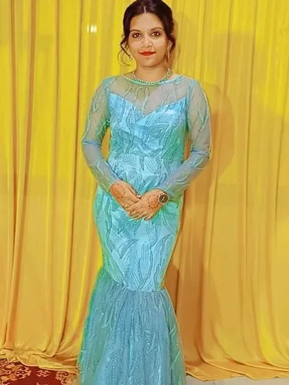 This is a sparkling blue fish-cut gown I designed for a wedding reception. The fabric has a beautiful leaf-like pattern.