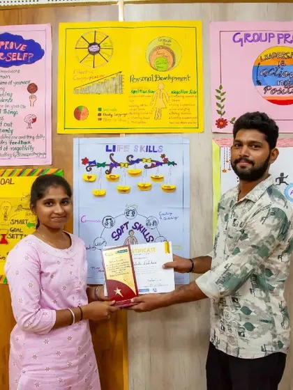 A graduate receives her certificate and award, marking her successful completion of the leadership program. Each certificate is a testament to her dedication to becoming a leader in her community.