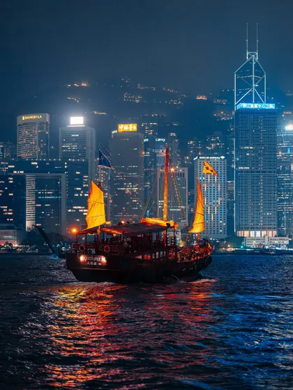 A traditional junk boat sailing across Victoria Harbour, with the modern skyline as a backdrop. This contrast between old and new is what makes Hong Kong so visually interesting.