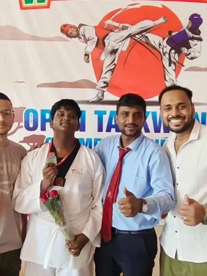A group of us celebrating a student's victory. The support and friendship in our team is strong.