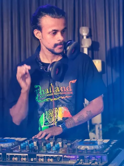 A shot of me at the decks, with my headphones on, getting ready for the next track.