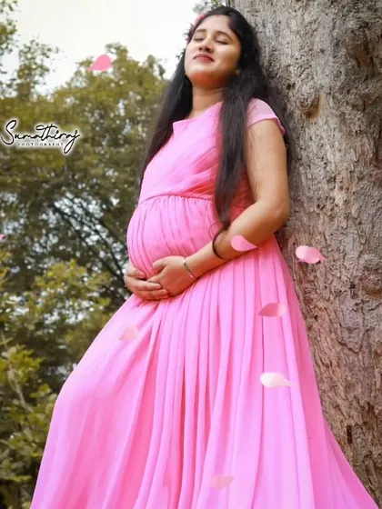 A peaceful and beautiful moment captured during a maternity shoot. The client is wearing our simple yet elegant pink gown.