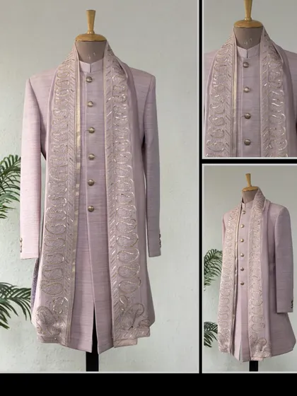 A classic Matka Silk Achkan in a soft lavender, paired with a paisley embroidered dupatta. A stylish and sophisticated choice for festive occasions.