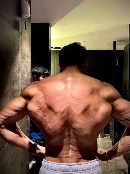 A full back lat spread. This is the physique of someone who never quits.