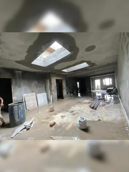This image shows a residential space under construction, highlighting the structural openings for skylights. We integrate features like these early in the process to maximize natural light and create a sense of volume.