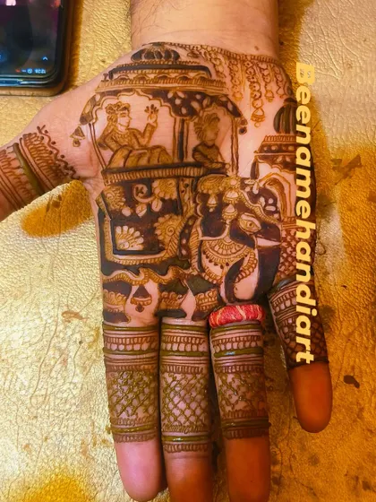 Mehandi is for grooms too! This design features a detailed doli scene on the palm, a perfect way for the groom to celebrate the wedding festivities.
