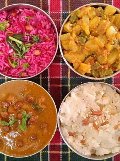 Our special Christmas tiffin spread. It featured a festive Beetroot Rice, Black Channa Curry, Lauki Aloo Sabzi, and a sweet Sooji Halwa to celebrate the season.