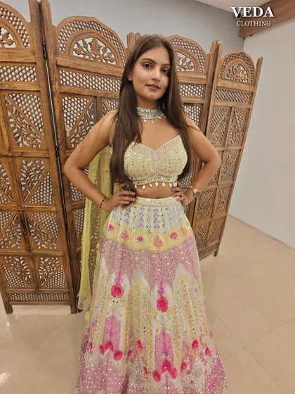 This multi-color lehenga with mirror work is a perfect, vibrant choice for a Mehendi or Haldi function.