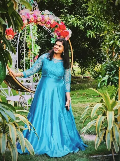 My sky blue satin gown is both elegant and eye-catching. The lace sleeves add a delicate touch, making it suitable for sangeets, receptions, or family functions.