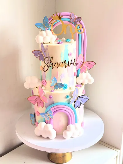 A still image of the beautiful pastel rainbow and butterfly cake. Her Maasi asked for something as colorful as her smile, and this was the result.