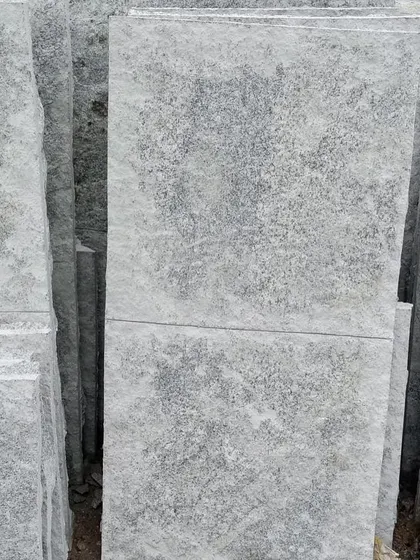 Stacks of rough-textured paving stones.