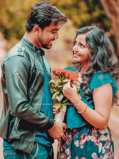 Lost in their own world. This shot captures the loving gaze between the couple, a beautiful memory from their pre-wedding session.