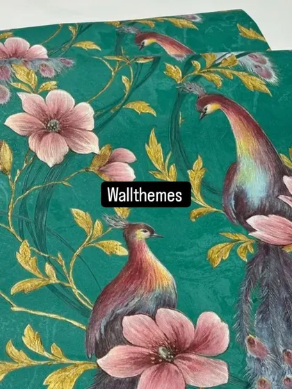 A detailed shot of a deep green wallpaper with a vibrant peacock and floral pattern.