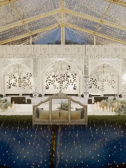 The central seating or 'gaddi' in front of the Thikri stage, offering the best view in the house. The design ensures that every element, from seating to stage, is part of a cohesive and beautiful story.